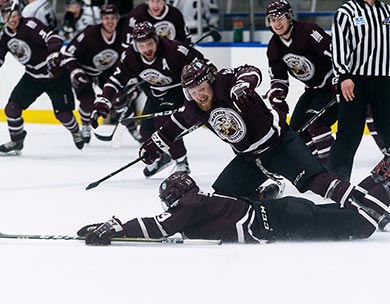 Led by Austin Yaremchuk, Griffins players rush to celebrate with a sliding Cam Gotaas after their captain scored the winning goal in double overtime on Saturday night (Matthew Jacula photo)