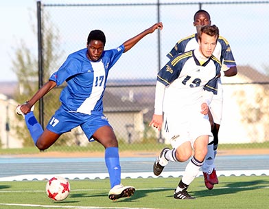 Joseph Lambele (left) chased down by Rene Nederby (#15 CUE)